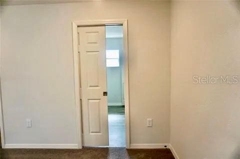 2607 Tulip Dr, Davenport, FL 33837 - spare room featuring baseboards
