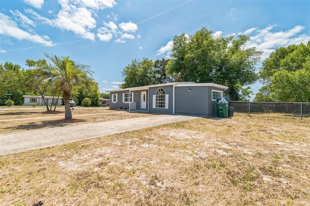 1234 Parker Ave, Deltona, FL 32725 - view of front of home with fence and concrete driveway