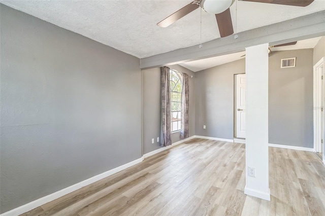 1234 Parker Ave, Deltona, FL 32725 - spare room with light wood-style floors, ceiling fan, visible vents, vaulted ceiling, and baseboards