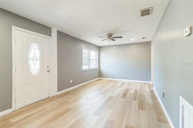 1234 Parker Ave, Deltona, FL 32725 - entrance foyer with a ceiling fan, visible vents, and light wood-type flooring