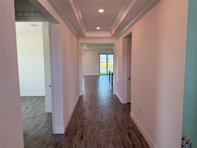 25126 Calusa Dr, Punta Gorda, FL 33955 - corridor with dark wood-type flooring, visible vents, a tray ceiling, and crown molding