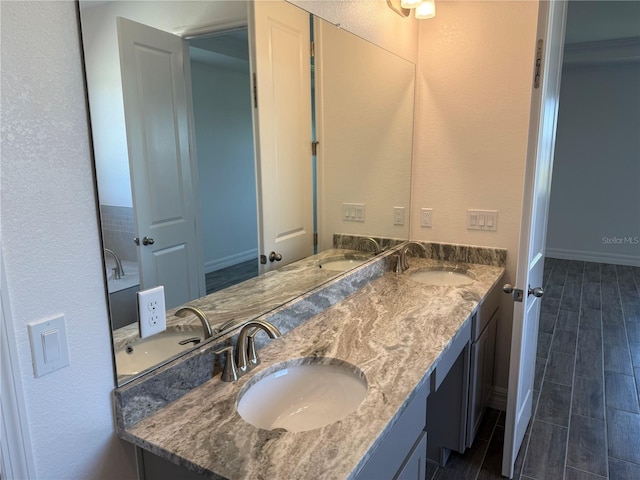 25126 Calusa Dr, Punta Gorda, FL 33955 - full bathroom featuring a sink and wood finish floors