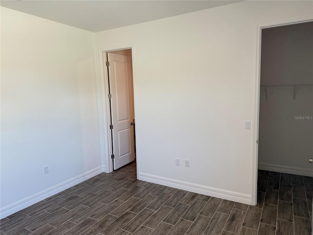 25126 Calusa Dr, Punta Gorda, FL 33955 - empty room featuring baseboards and wood tiled floor