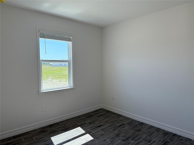 25126 Calusa Dr, Punta Gorda, FL 33955 - unfurnished room with baseboards and wood tiled floor