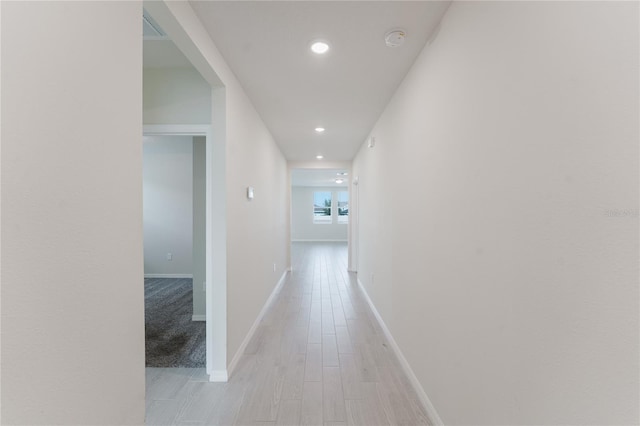 349 Guadlupe St, Haines City, FL 33844 - corridor featuring light wood-style flooring, baseboards, and recessed lighting