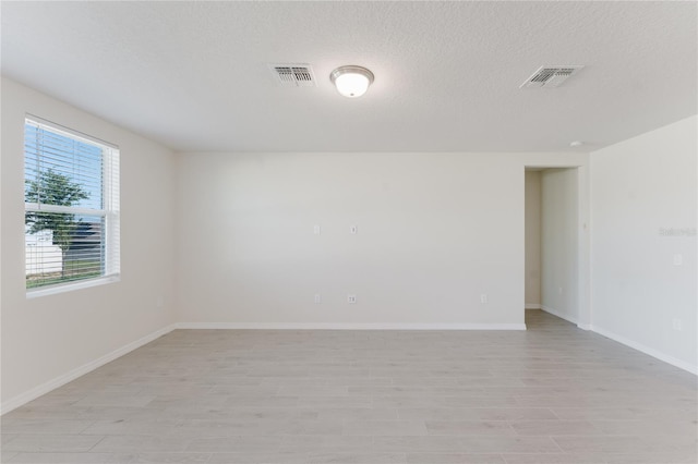 349 Guadlupe St, Haines City, FL 33844 - unfurnished room with visible vents, baseboards, and light wood-style floors