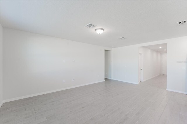 349 Guadlupe St, Haines City, FL 33844 - unfurnished room featuring light wood-type flooring, baseboards, and visible vents