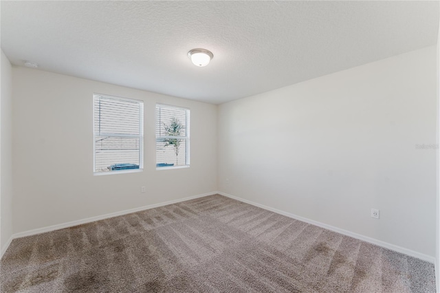 349 Guadlupe St, Haines City, FL 33844 - carpeted spare room with baseboards and a textured ceiling