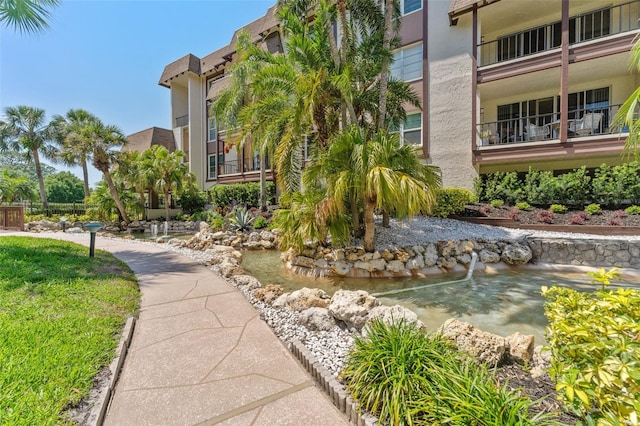 3035 Countryside Blvd Unit 15B, Clearwater, FL 33761 - surrounding community with a garden pond