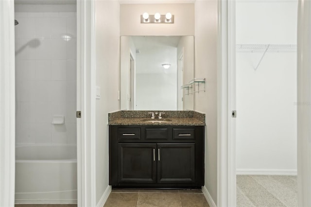 611 Marsh Reed Dr, Winter Garden, FL 34787 - full bath featuring shower / bath combination, vanity, baseboards, and a walk in closet