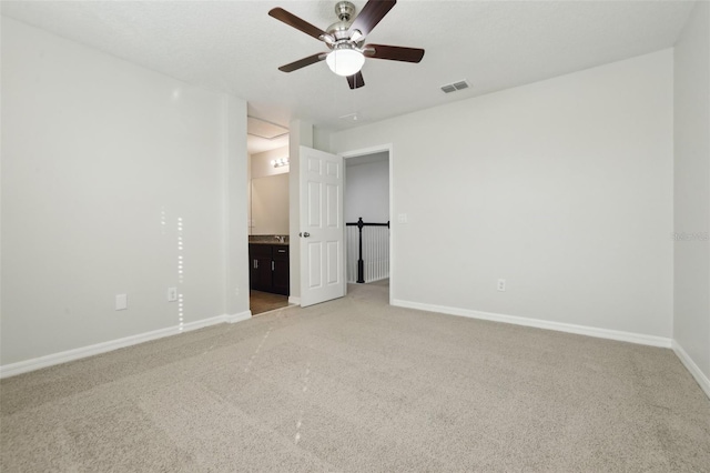 611 Marsh Reed Dr, Winter Garden, FL 34787 - unfurnished bedroom with light carpet, baseboards, visible vents, and ensuite bath