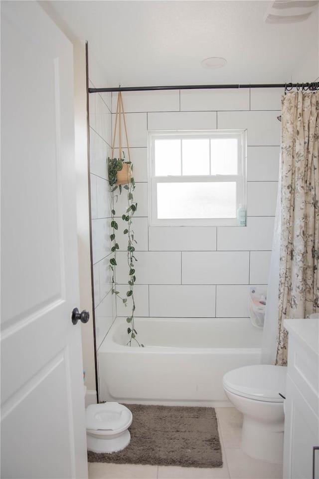full bath featuring tile patterned floors, shower / bath combo, vanity, and toilet