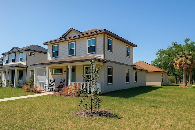 900 S Maple Ave, Sanford, FL 32771 - view of front facade featuring a porch, a front yard, and stucco siding