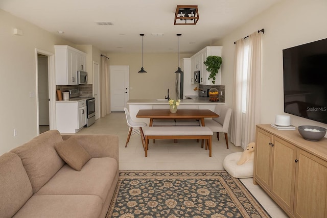 900 S Maple Ave, Sanford, FL 32771 - living room with light tile patterned flooring