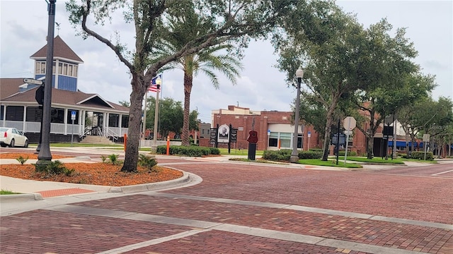 900 S Maple Ave, Sanford, FL 32771 - view of decorative street featuring street lighting, sidewalks, curbs, and traffic signs