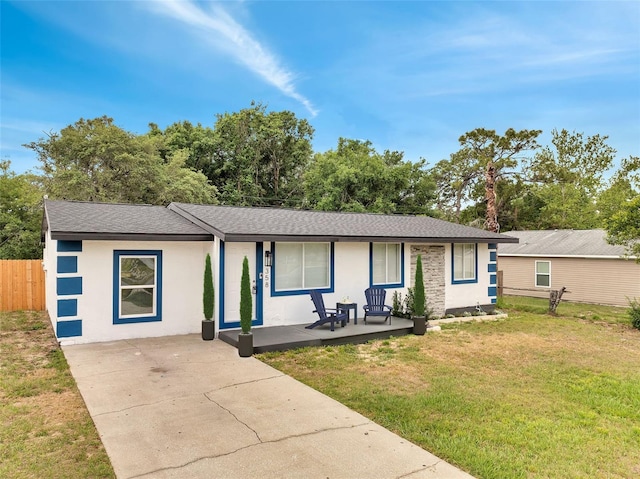 358 Prevo Dr, Apopka, FL 32712 - single story home with a front lawn, fence, stucco siding, a shingled roof, and a porch