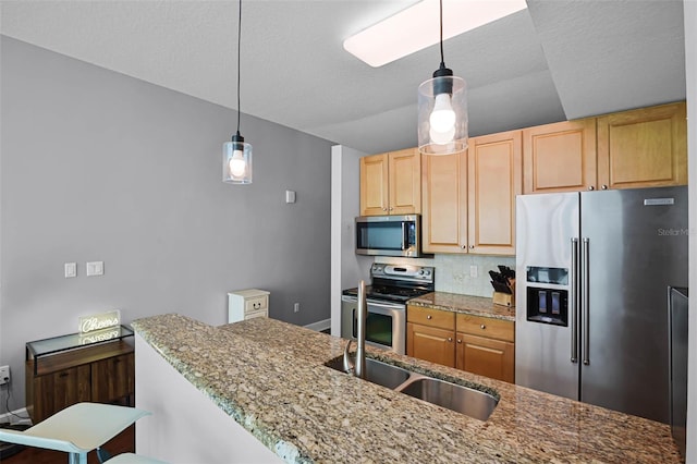 101 S Eola Dr Unit 1018, Orlando, FL 32801 - kitchen featuring light stone countertops, light brown cabinetry, a sink, stainless steel appliances, and backsplash