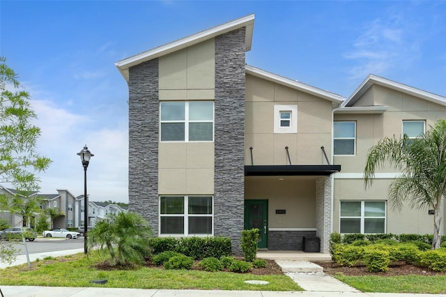 2400 Reading Trl, Kissimmee, FL 34746 - view of front of property with stone siding and stucco siding