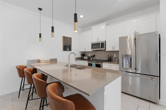 2400 Reading Trl, Kissimmee, FL 34746 - kitchen with tasteful backsplash, a sink, light tile patterned flooring, stainless steel appliances, and a kitchen bar