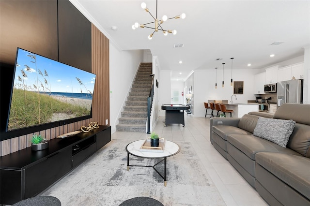 2400 Reading Trl, Kissimmee, FL 34746 - living room with light tile patterned flooring, visible vents, recessed lighting, a notable chandelier, and stairway