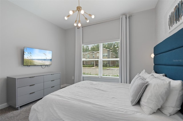 2400 Reading Trl, Kissimmee, FL 34746 - carpeted bedroom featuring baseboards and a notable chandelier