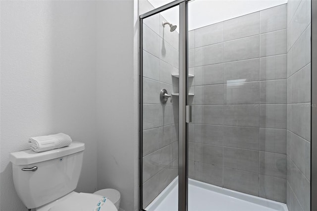 2400 Reading Trl, Kissimmee, FL 34746 - full bathroom featuring toilet and a stall shower