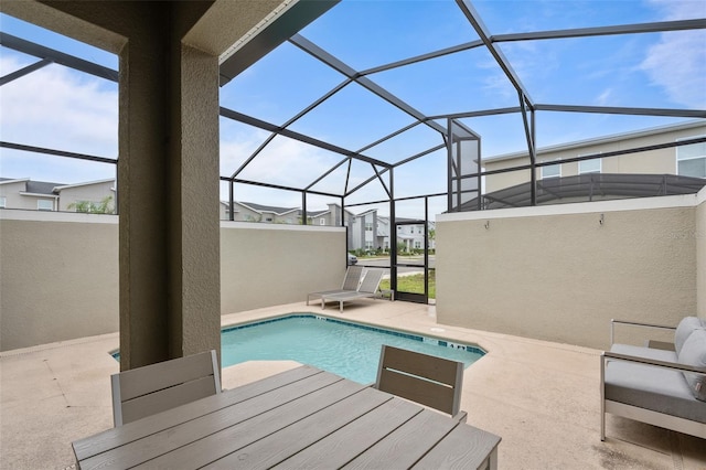 2400 Reading Trl, Kissimmee, FL 34746 - pool featuring glass enclosure, a residential view, outdoor dining space, and a patio
