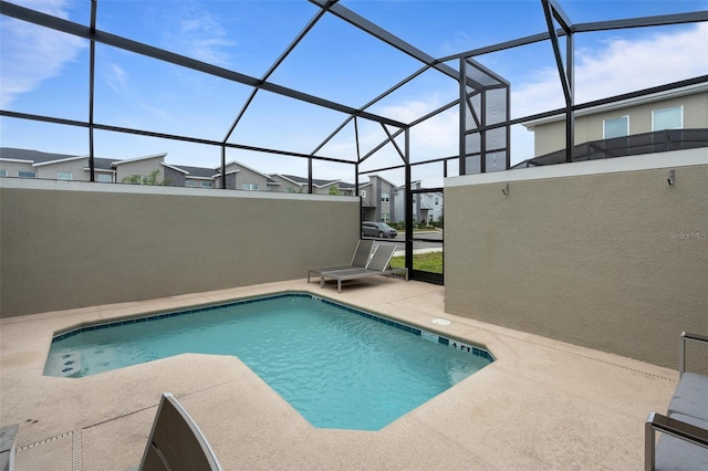 2400 Reading Trl, Kissimmee, FL 34746 - outdoor pool with glass enclosure, a residential view, and a patio