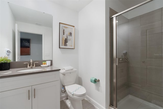 2400 Reading Trl, Kissimmee, FL 34746 - full bath with a shower stall, tile patterned flooring, toilet, vanity, and baseboards