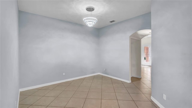 2167 Velvet Leaf Dr, Ocoee, FL 34761 - unfurnished room with arched walkways, light tile patterned flooring, baseboards, and visible vents