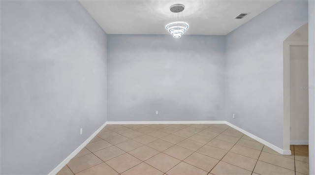 2167 Velvet Leaf Dr, Ocoee, FL 34761 - unfurnished room featuring arched walkways, light tile patterned floors, baseboards, and visible vents