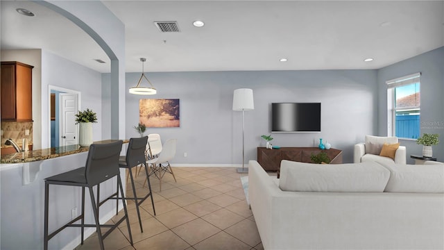 2167 Velvet Leaf Dr, Ocoee, FL 34761 - living area with recessed lighting, visible vents, baseboards, and light tile patterned flooring