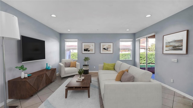 2167 Velvet Leaf Dr, Ocoee, FL 34761 - living area featuring recessed lighting, light tile patterned floors, baseboards, and a healthy amount of sunlight