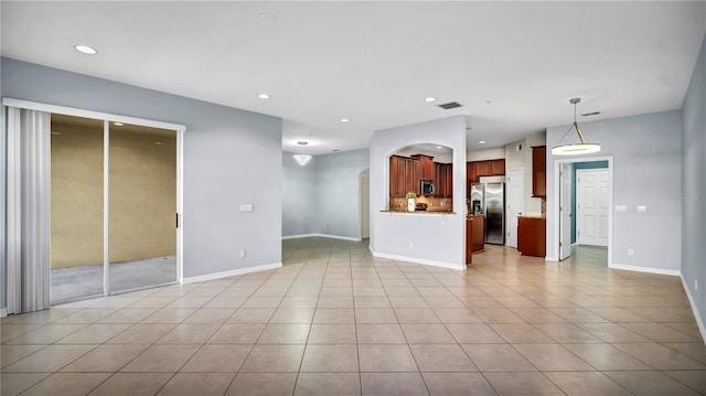2167 Velvet Leaf Dr, Ocoee, FL 34761 - unfurnished living room featuring baseboards, recessed lighting, and light tile patterned flooring