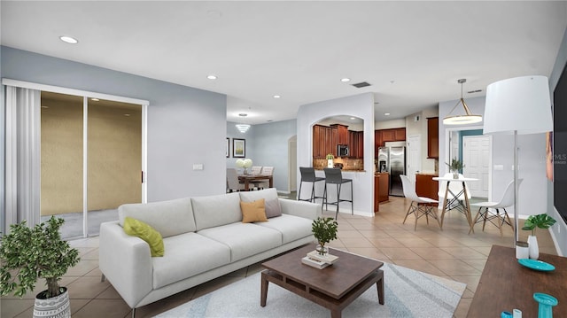 2167 Velvet Leaf Dr, Ocoee, FL 34761 - living area with light tile patterned floors, baseboards, recessed lighting, and visible vents