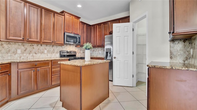 2167 Velvet Leaf Dr, Ocoee, FL 34761 - kitchen featuring backsplash, light stone countertops, and stainless steel appliances