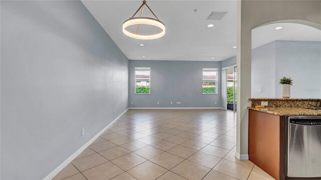 2167 Velvet Leaf Dr, Ocoee, FL 34761 - unfurnished dining area with arched walkways, light tile patterned floors, baseboards, and visible vents