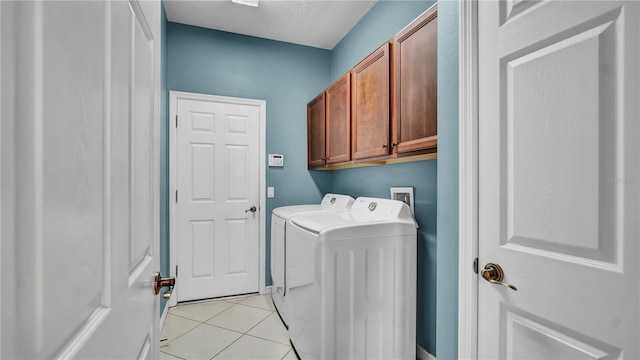 2167 Velvet Leaf Dr, Ocoee, FL 34761 - laundry room featuring light tile patterned floors, independent washer and dryer, and cabinet space