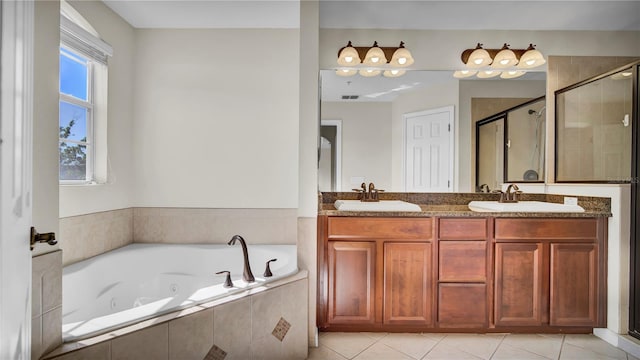 2167 Velvet Leaf Dr, Ocoee, FL 34761 - full bath with a sink, a jetted tub, a stall shower, and double vanity