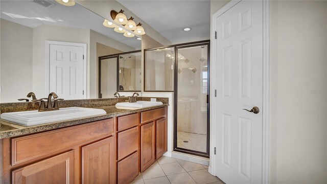 2167 Velvet Leaf Dr, Ocoee, FL 34761 - full bath featuring a sink, a shower stall, tile patterned flooring, and double vanity