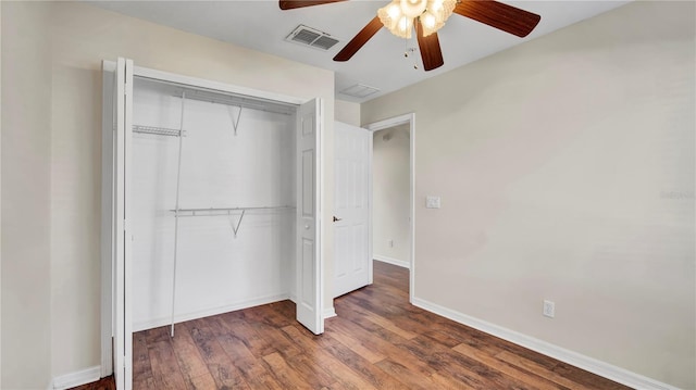 2167 Velvet Leaf Dr, Ocoee, FL 34761 - unfurnished bedroom with visible vents, baseboards, a closet, and wood finished floors