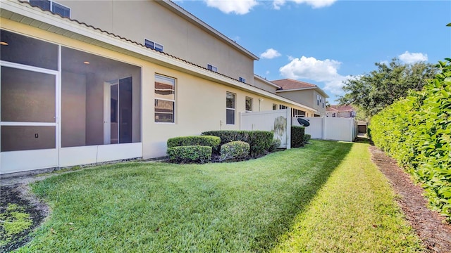 2167 Velvet Leaf Dr, Ocoee, FL 34761 - view of yard featuring a sunroom and fence