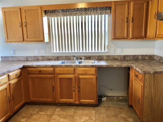 1805 San Luis Ln, The Villages, FL 32159 - kitchen featuring a sink, brown cabinets, and light tile patterned floors