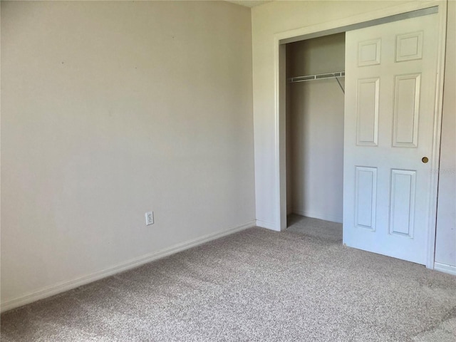 1805 San Luis Ln, The Villages, FL 32159 - unfurnished bedroom with carpet floors, baseboards, and a closet