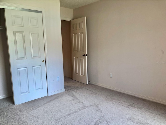 1805 San Luis Ln, The Villages, FL 32159 - unfurnished bedroom featuring carpet floors and baseboards