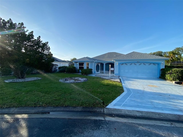 1805 San Luis Ln, The Villages, FL 32159 - ranch-style home featuring a garage, a front lawn, and driveway