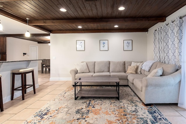 living room with beamed ceiling, recessed lighting, wooden ceiling, light tile patterned flooring, and baseboards