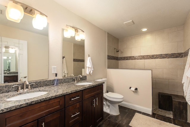 full bathroom with walk in shower, a sink, and toilet