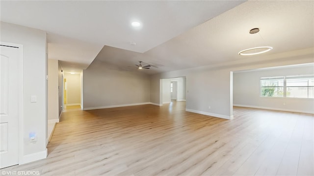 7845 Clubhouse Estates Dr, Orlando, FL 32819 - unfurnished living room featuring light wood-style flooring, baseboards, and ceiling fan