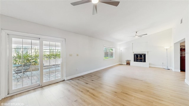 7845 Clubhouse Estates Dr, Orlando, FL 32819 - unfurnished living room featuring lofted ceiling, a ceiling fan, light wood-style floors, and baseboards